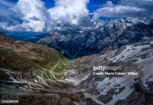 landscape of mountain range under dramatic sky - mario calma stockfoto's en -beelden