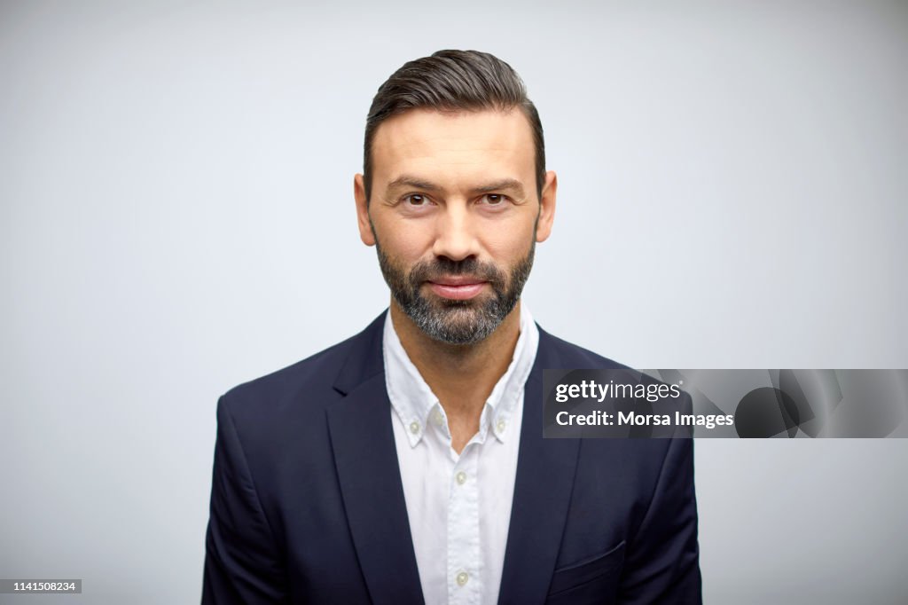 Portrait of well-dressed mature businessman