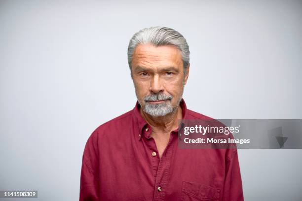 portrait of senior businessman wearing shirt - bigode imagens e fotografias de stock