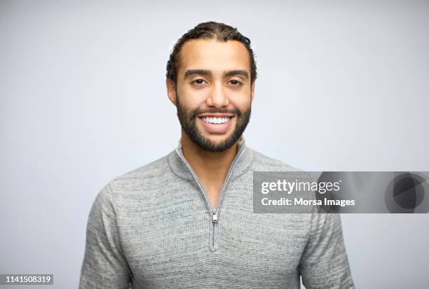 smiling bearded businessman wearing casuals - cultura araba foto e immagini stock