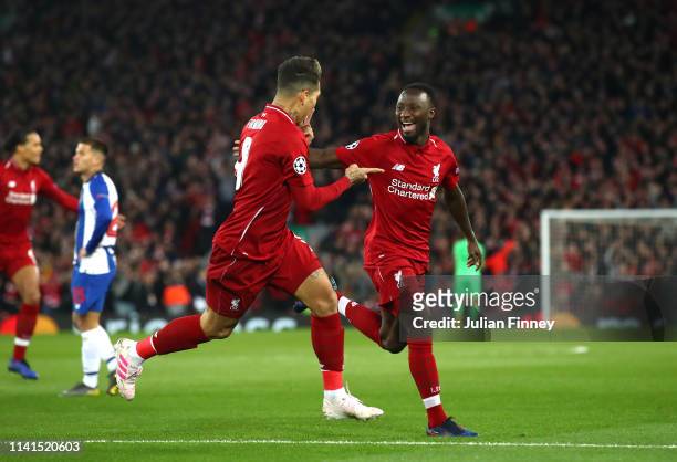 Naby Keita of Liverpool celebrates after scoring his team's first goal with Roberto Firmino of Liverpool during the UEFA Champions League Quarter...