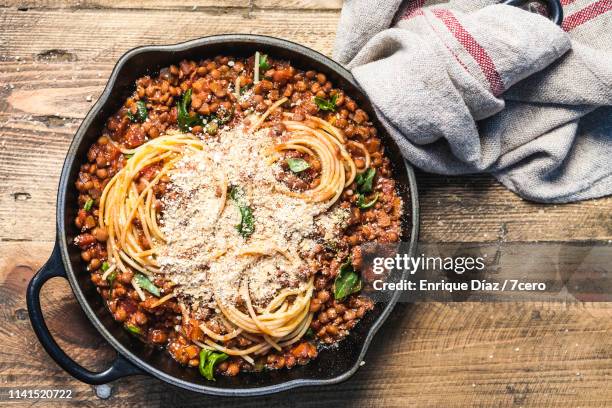 rustic skillet spaghetti bolognese with parmesan cheese - 7cero food stock pictures, royalty-free photos & images
