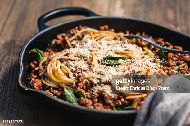 rustic skillet spaghetti bolognese close up - 洋食 ストックフォトと画像