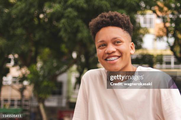 portrait of a brazilian guy looking at somewhere away. - adolescence photos stock pictures, royalty-free photos & images