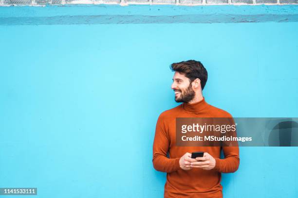 text messaging. - blue tee stock pictures, royalty-free photos & images