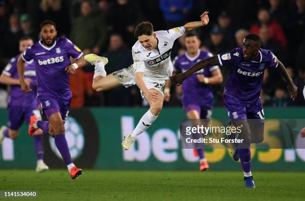 Stoke player Bruno Martins Indi is sent off for this challenge on Daniel James of Swansea during the Sky Bet Championship match between Swansea City...
