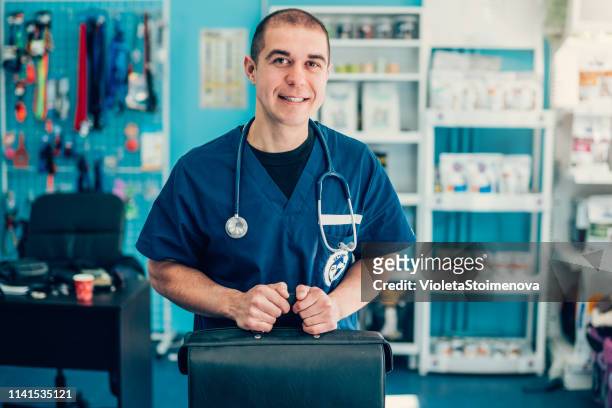 portrait of a happy veterinarian - doctor's bag stock pictures, royalty-free photos & images
