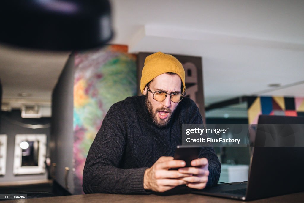 Hipster entrepreneur shocked by the news