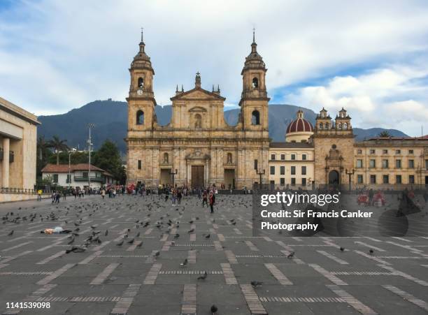 facade of bogota cathedral and capilla del sagrario on bolivar square (plaza bolivar) rightbeforesunset in bogota, colombia - la candelaria bogota stock-fotos und bilder