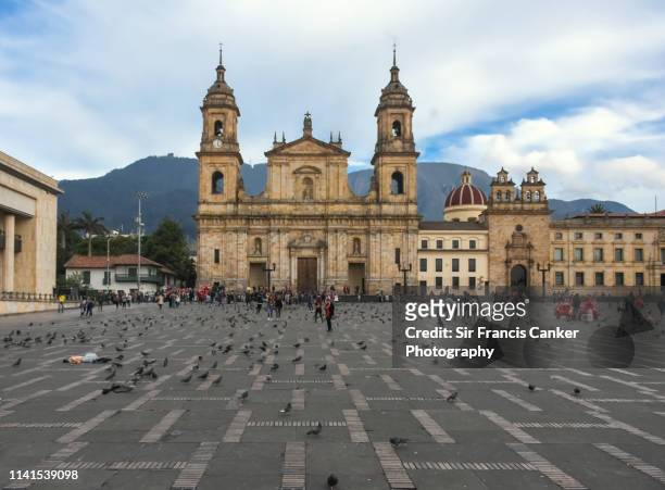 facade of bogota cathedral and capilla del sagrario on bolivar square (plaza bolivar) rightbeforesunset in bogota, colombia - bogota stock pictures, royalty-free photos & images