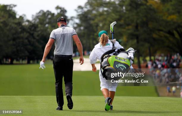 Henrik Stenson of Sweden and caddie Fanny Sunesson walk during a practice round prior to the Masters at Augusta National Golf Club on April 09, 2019...