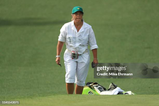 Fanny Sunesson, caddie for Henrik Stenson of Sweden ,, looks on during a practice round prior to the Masters at Augusta National Golf Club on April...