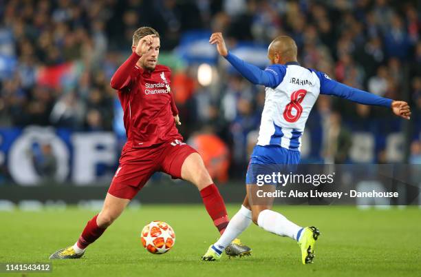 Jordan Henderson of Liverpool competes for the ball with Yacine Brahimi of Porto during the UEFA Champions League Quarter Final first leg match...