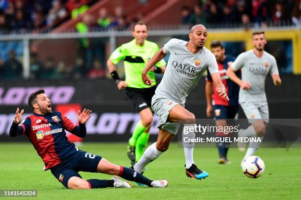 Roma French midfielder Steven Nzonzi vies with Genoa's Brazilian midfielder Daniel Bessa during the Italian Serie A football match between Genoa and...