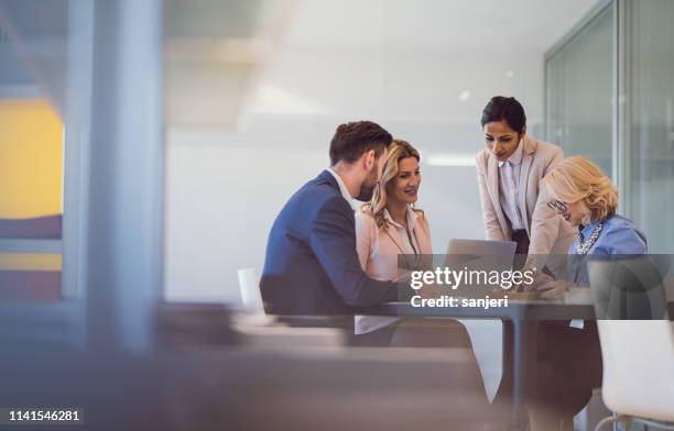 business people discussing in the office - blank computer stock pictures, royalty-free photos & images