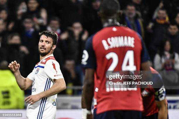 Lyon's French defender Leo Dubois celebrates after scoring a goal during the French L1 football match between Olympique Lyonnais and Lille on May 5...