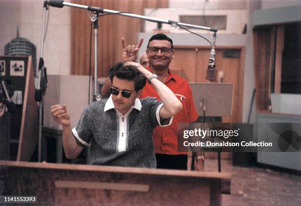 Frankie Laine at a recording session with Michel Legrand on May 26, 1958.