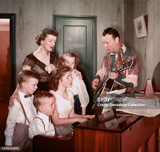 Roy Rogers and Dale Evans with their family at home in 1958'.