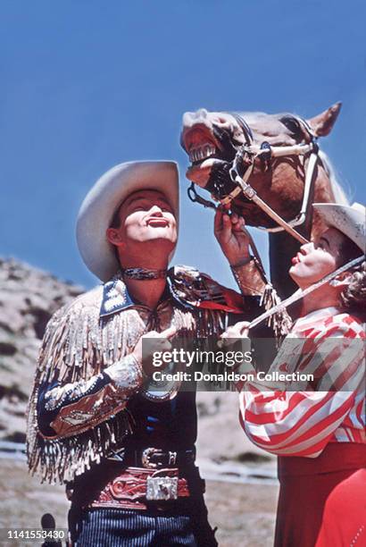 Roy Rogers, Dale Evans and Trigger the horse pose for a portrait on May 12, 1958.