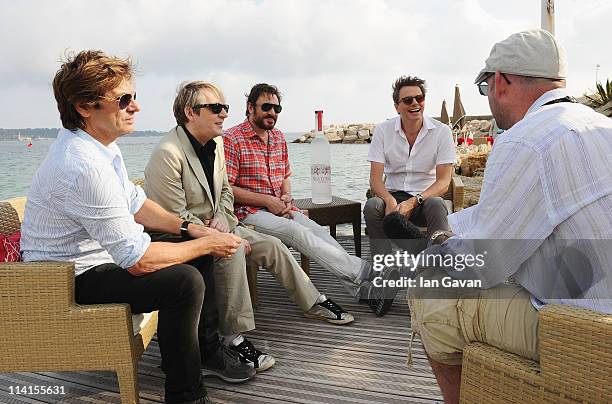 Musicians Roger Taylor, Nick Rhodes, Simon Le Bon and John Taylor of Duran Duran interview at a photocall during the 64th Annual Cannes Film Festival...