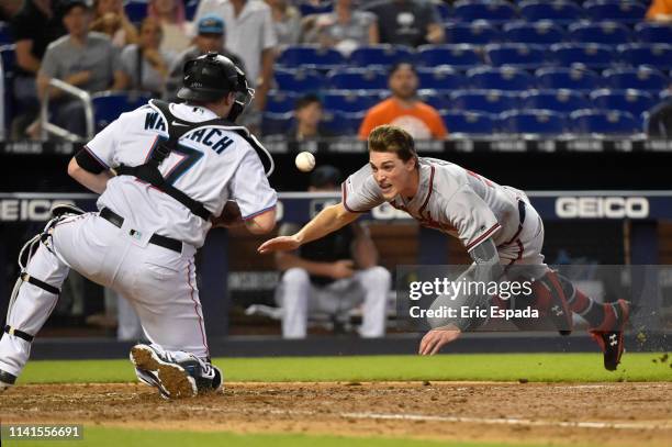 Max Fried of the Atlanta Braves scores on a double by Ender Inciarte during the eighth inning against the Miami Marlins at Marlins Park on May 5,...