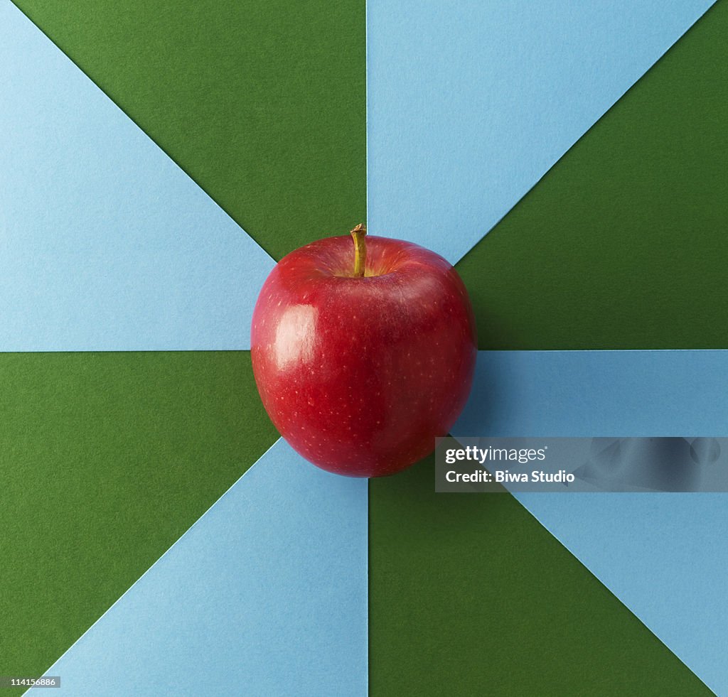 Apple on blue & green background