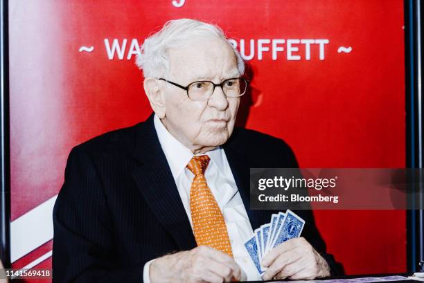 Warren Buffett, chairman and chief executive officer of Berkshire Hathaway Inc., plays bridge at an event on the sidelines of the Berkshire Hathaway...
