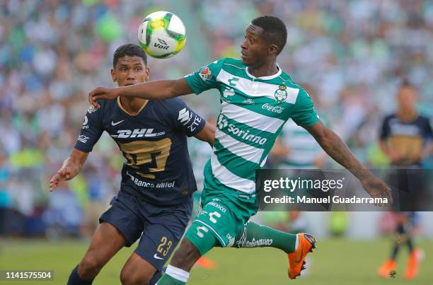 Marlos Moreno of Santos and Jeison Angulo of Pumas fights for the ball during the 17th round match between Santos Laguna and Pumas UNAM as part of...