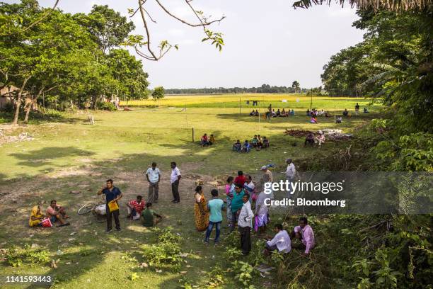 People attend a campaign rally with West Benghal Chief Minister Mamata Banerjee in Swarupnagar, West Bengal, India, on Monday, April 29, 2019....