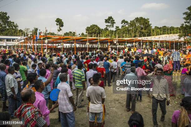 People attend a campaign rally with West Benghal Chief Minister Mamata Banerjee in Swarupnagar, West Bengal, India, on Monday, April 29, 2019....