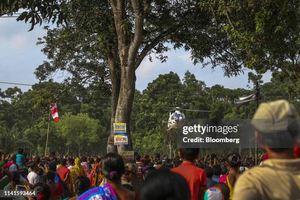 Helicopter carrying West Benghal Chief Minister Mamata Banerjee takes off following a campaign rally in Swarupnagar, West Bengal, India, on Monday,...