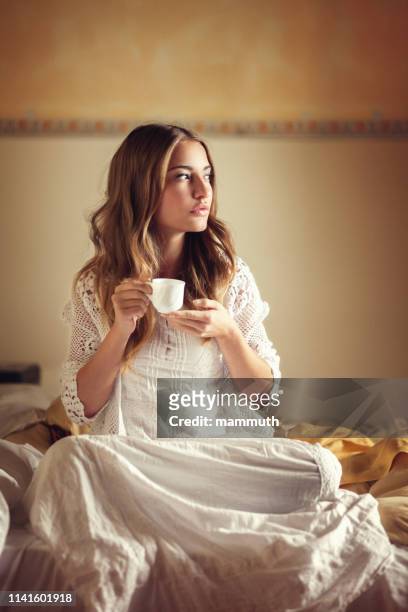 young woman drinking coffee in the morning - espresso stock pictures, royalty-free photos & images