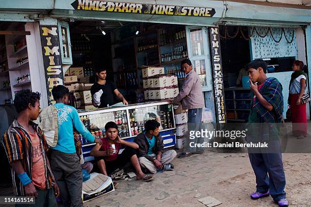 People gather outside of wine store on market day on April 15, 2011 in Lad Rymbai, in the district of Jaintia Hills, India. Market days, a non...