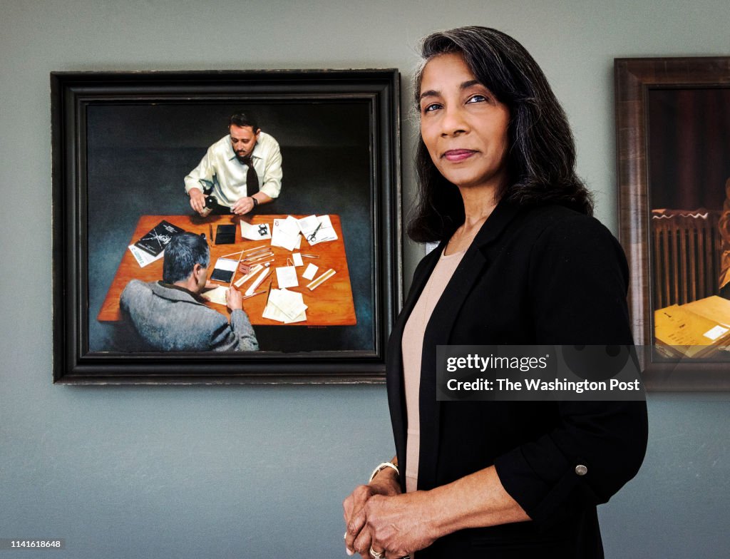 Deborah Dismuke, 63, who has painted two works honoring agency achievements that adorn the headquarters, in McLean, VA.
