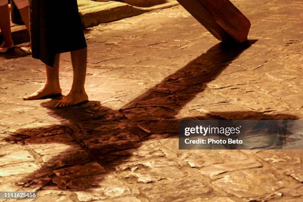 a suggestive scene of the stations of the cross during the easter celebrations in the center of oaxaca in mexico - stations of the cross stock pictures, royalty-free photos & images