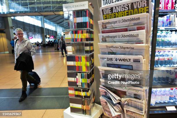 Stand with some daily German newspapers seen in a book shop at Helmut Schmidt International Hamburg Airport. On Saturday, May 4 in Hamburg, Germany..