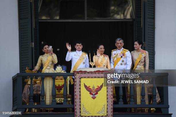 Thailand's Princess Sirivannavari Nariratana takes a photo as she stands with her brother Prince Dipangkorn Rasmijoti , sister Princess...