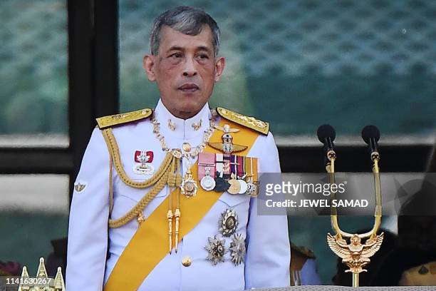 Thailand's King Maha Vajiralongkorn appears on the balcony of Suddhaisavarya Prasad Hall of the Grand Palace during a public audience on the final...