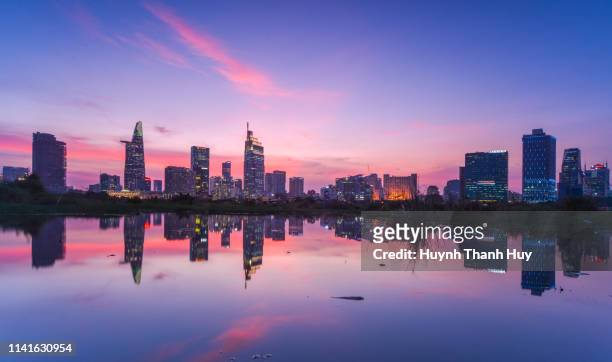center of ho chi minh city by sunset reflection - ho chi minh city 個照片及圖片檔