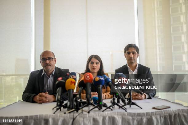 Turkish Kurd leader Abdullah Ocalan's lawyers Faik Ozgur Erol, Newroz Uysal, Rezan Sarica prepare to read Ocalan's message on May 6 in Istanbul. -...
