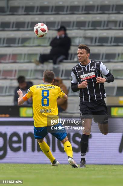 Stephan Fuerstner of Eintracht Braunschweig and Petar Sliskovic of VfR Aalen battle for the ball during the 3. Liga match between VfR Aalen and...