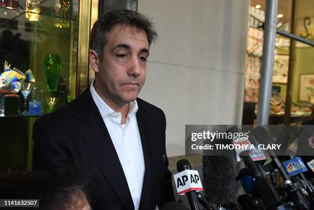 Michael Cohen, the former lawyer for US President Donald Trump, talks to the press as he leaves his Park Avenue apartment May 6, 2019 in New York...