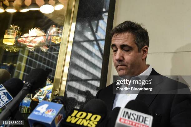 Michael Cohen, former personal lawyer to U.S. President Donald Trump, pauses while speaking to members of the media outside of his home in New York,...