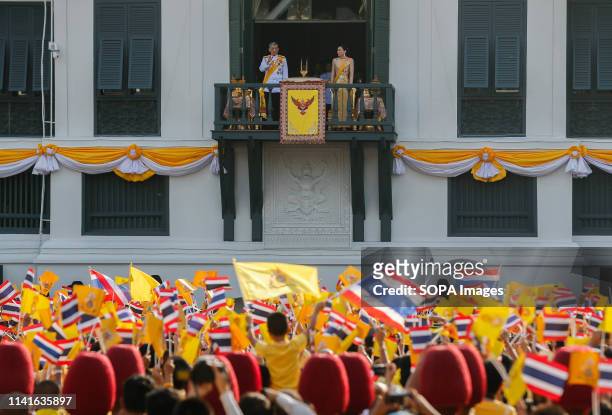 Thailand's King Maha Vajiralongkorn Bodindradebayavarangkun and Queen Suthida appear on the balcony of Suddhaisavarya Prasad Hall of the Grand Palace...