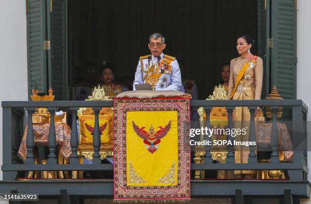 Thailand's King Maha Vajiralongkorn Bodindradebayavarangkun and Queen Suthida appear on the balcony of Suddhaisavarya Prasad Hall of the Grand Palace...