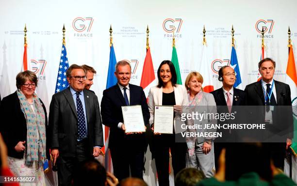 French Environment Minister Francois de Rugy and French Junior Minister for Environment Brune Poirson hold a certificate for a AFNOR-normalization...