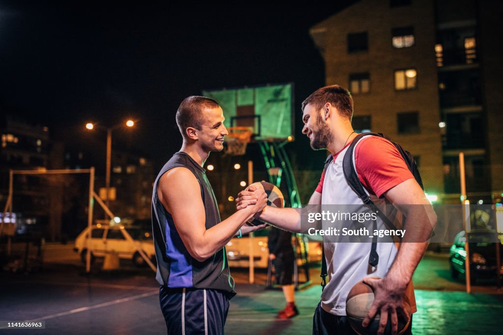 Streetball friends handshake after game