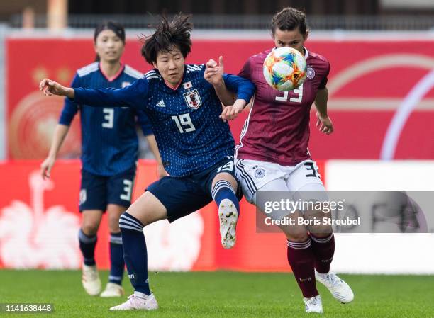 Jun Endo of Japan battles for the ball with Lena Sophie Oberdorf of Germany during the Women's International Friendly match between Germany and Japan...