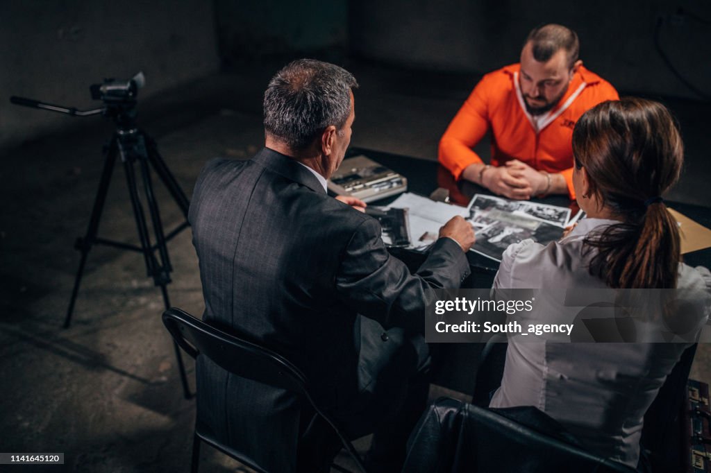 Police investigating a prisoner