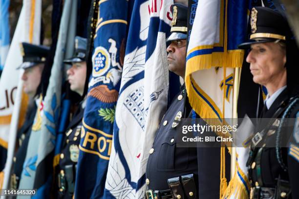 Capitol Police honor guard member, 2nd from right, participates in the presentation of the colors with a multi-jurisictional honor guard during the...